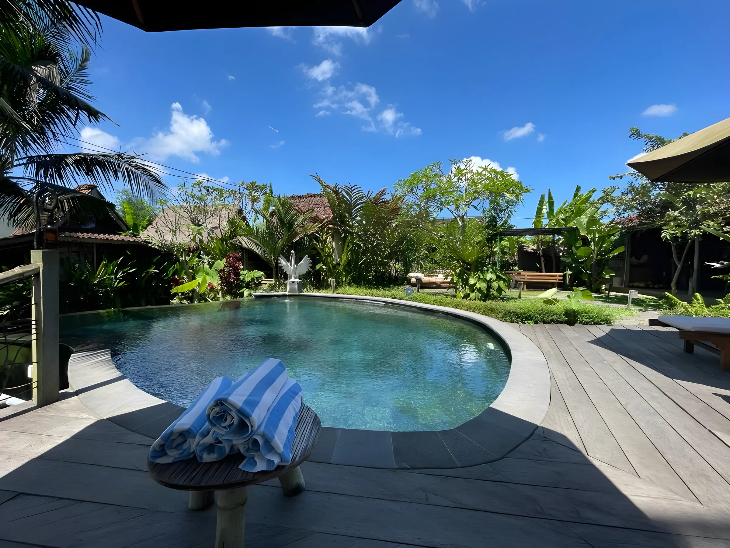The pool at Swarma Villas Bali, with the houses behind it